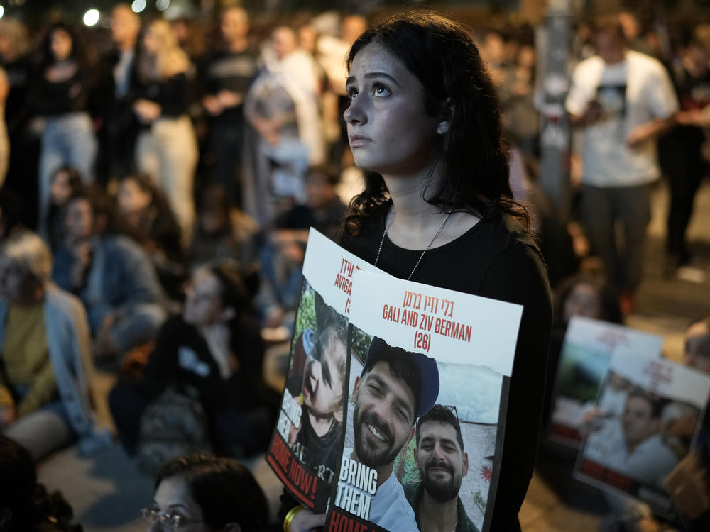 People participate in a show of solidarity with hostages being held in the Gaza Strip, at 