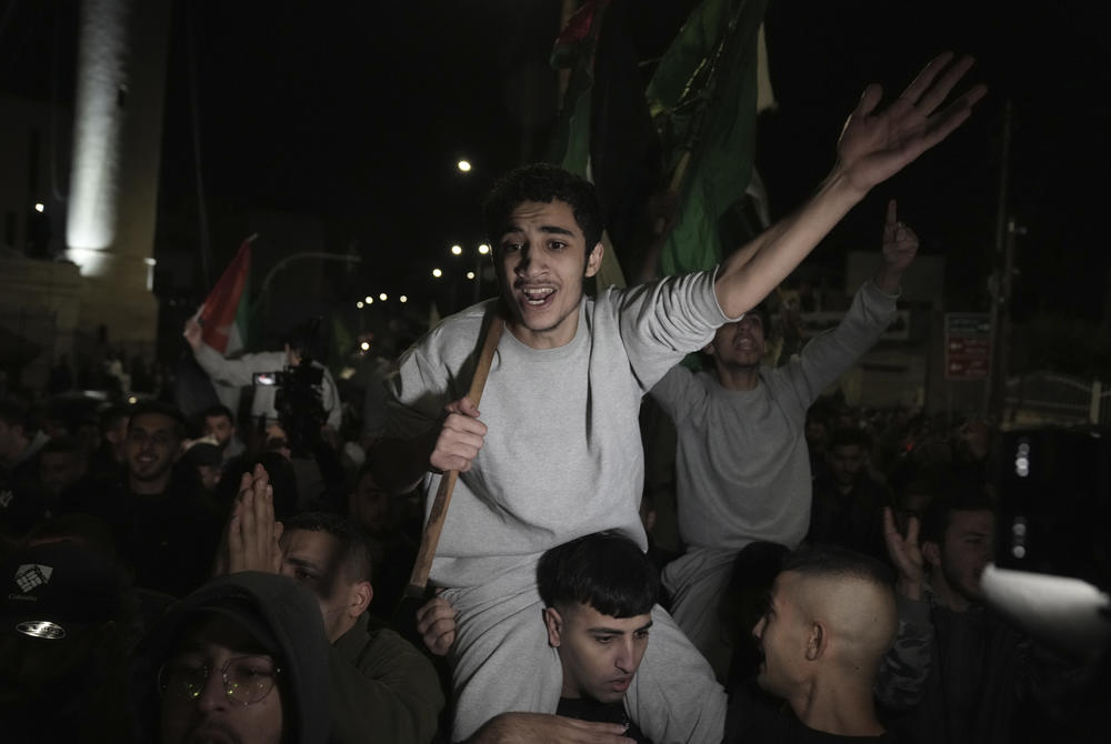 Palestinian prisoners released by Israel are welcomed to the West Bank town of Al Bireh Sunday Nov. 26, 2023.