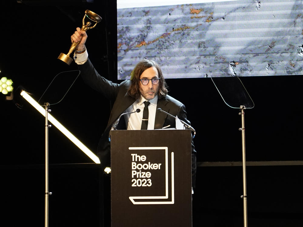 Paul Lynch, winner of the 2023 Booker Prize, celebrates shortly after the announcement in London on Sunday.