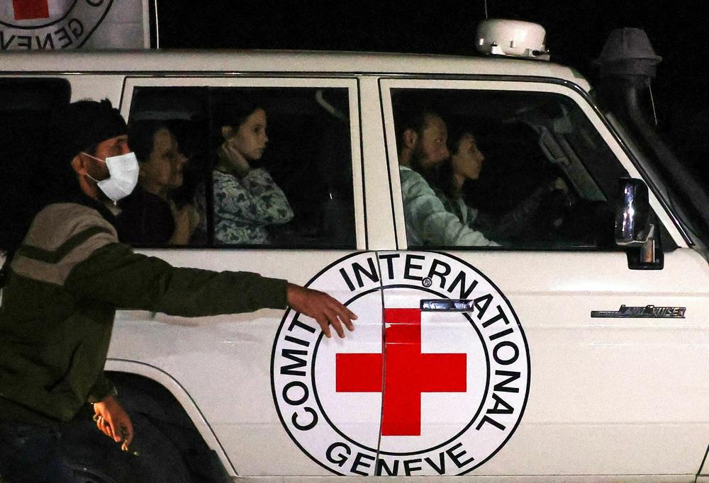 An International Red Cross vehicle carrying hostages released by Hamas drives towards the Rafah border point with Egypt ahead of their transfer to Israel on Nov. 25, 2023.