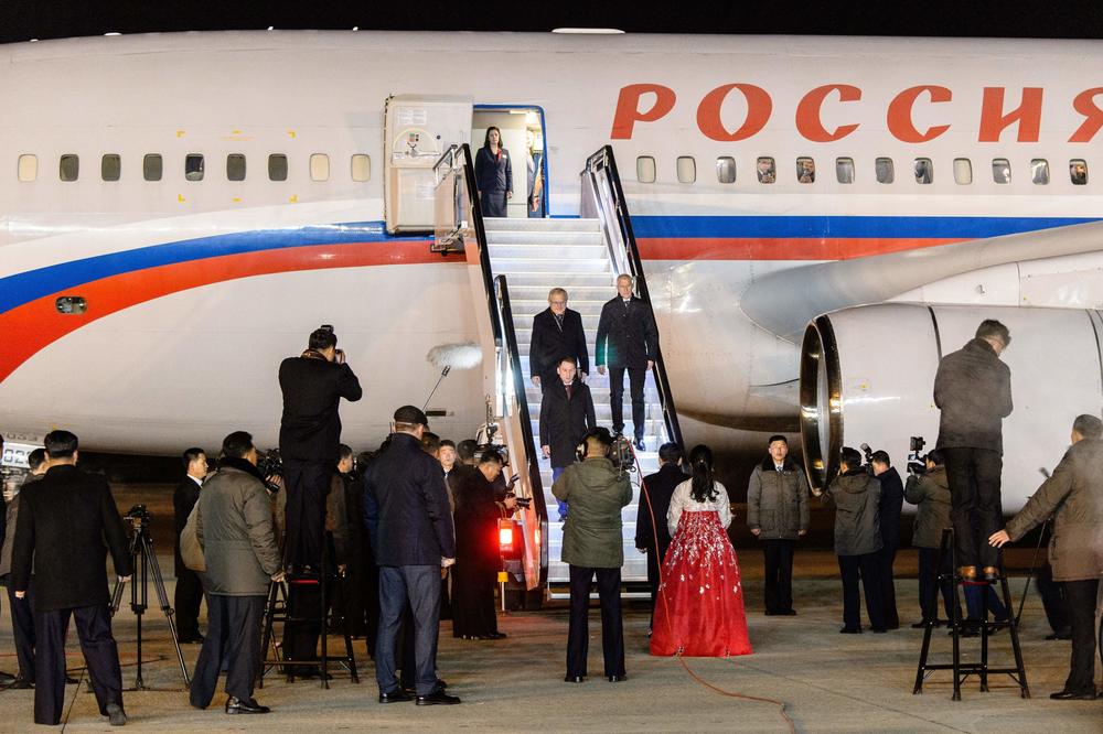 Russia's Minister of Natural Resources and Environment Alexander Kozlov (center) arrives with his delegation in Pyongyang on Nov. 14.