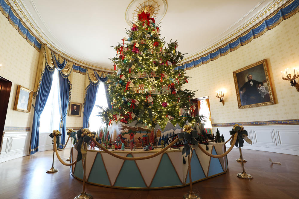 The official Christmas tree, an 18-foot-tall Fraser Fir from Fleetwood, N.C., stands in the center of the oval Blue Room during a media preview of the 2023 holiday decorations at the White House on Monday.
