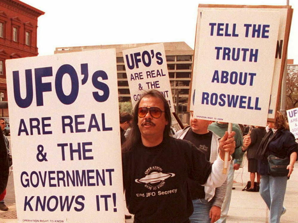 A group of protestors march in front of the General Accounting Office on March 29, 1995, to raise awareness about the mysterious object that was found in Roswell, N.M., in 1947.
