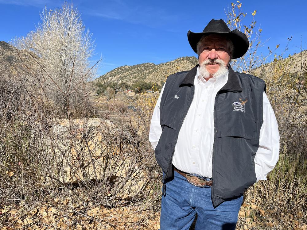 West of Glenwood Canyon, retired Colorado game warden Perry Will stands at a popular fishing access area along Interstate 70.