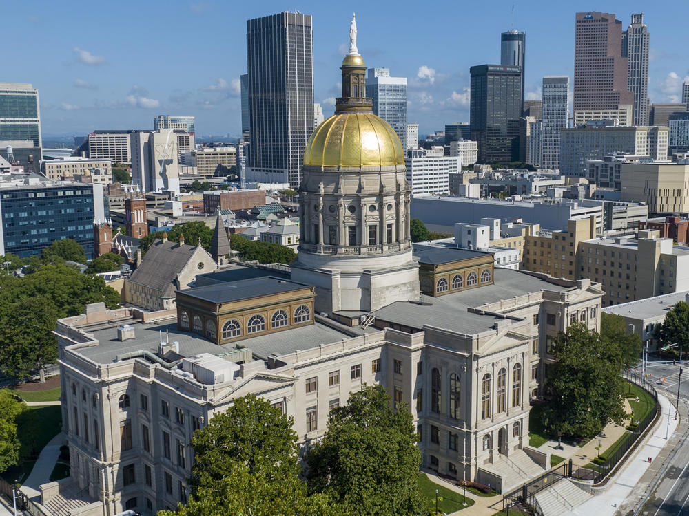 The Georgia Capitol is seen on Aug. 27, 2022, in front of the Atlanta skyline. State lawmakers will gather Wednesday to start work on new political district maps.