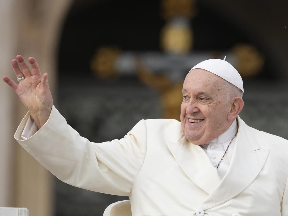 Pope Francis waves to the  faithful at the end of his weekly general audience in St. Peter's Square at the Vatican on Wednesday, Nov. 22, 2023. The pope, who will turn 87 next month, canceled his trip to Dubai for the U.N. climate conference on doctors' orders.