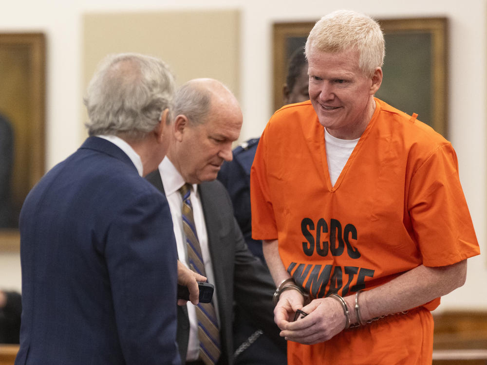 Alex Murdaugh, right, talks with his attorneys Dick Harpootlian, left, and Jim Griffin during his sentencing for stealing from 18 clients on Tuesday, Nov. 28, 2023, at the Beaufort County Courthouse in Beaufort, S.C.