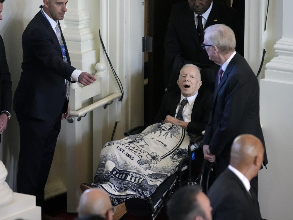 Former President Jimmy Carter, arrives to attend a tribute service for his wife and former first lady Rosalynn Carter, at Glenn Memorial Church, Tuesday, Nov. 28, 2023, in Atlanta.