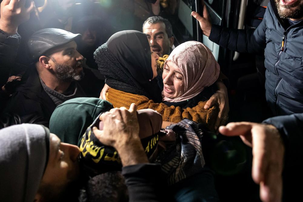 A Palestinian female prisoner hugs a relative in the occupied West Bank after being freed from an Israeli jail in exchange for Israeli hostages released by Hamas from the Gaza Strip,  Nov. 28.