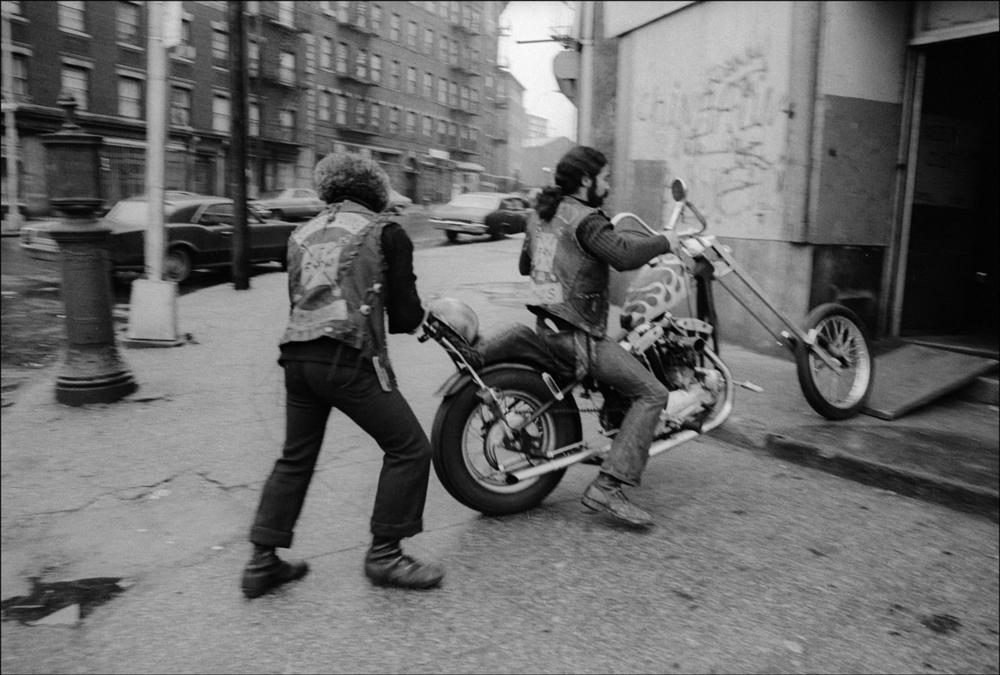 Members of the Ching-a-Lings motorcycle gang go into the group's clubhouse in the South Bronx in 1975.