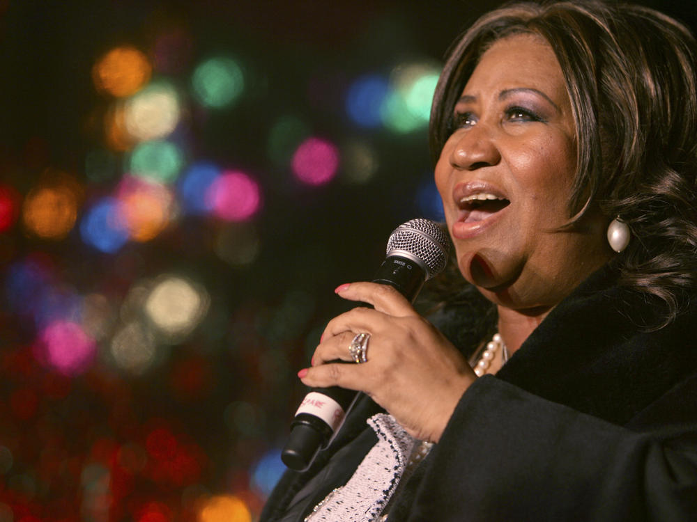 In this Dec. 4, 2008 file photo, Aretha Franklin performs during the 85th annual Christmas tree lighting at the New York Stock Exchange in New York.