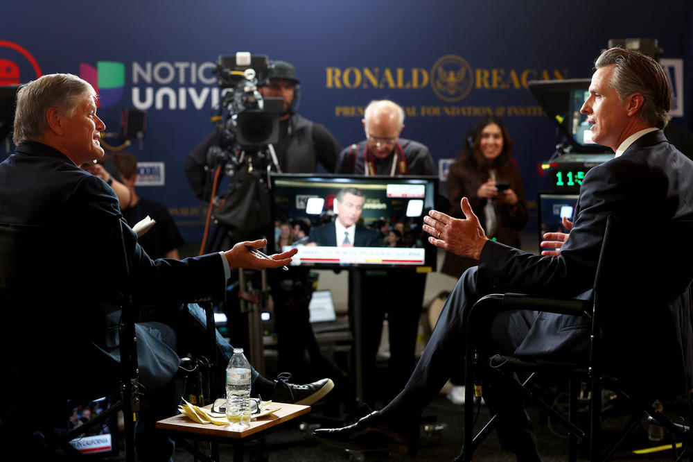 California Gov. Gavin Newsom (R) is interviewed by Sean Hannity in the spin room following the Fox Business Republican Primary Debate in Simi Valley, Calif. on September 27, 2023.