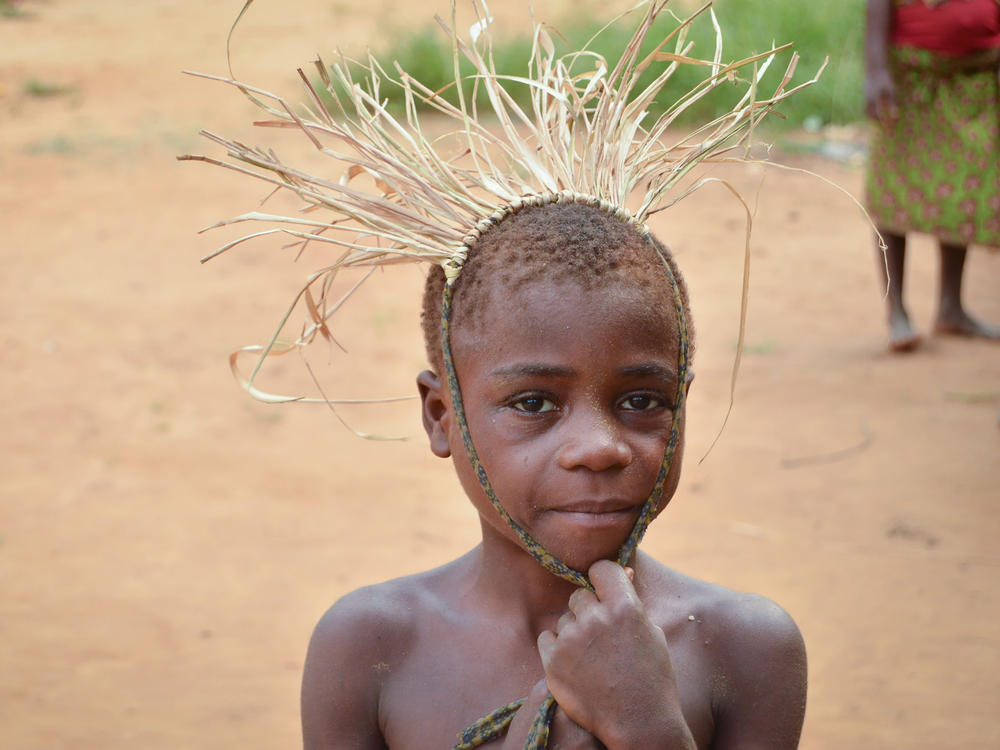 A child from the Mbendjele people, a hunter-gatherer community that lives in the northern rainforests of the Republic of Congo. A new study found that children in this society have on average 8 caregivers in addition to the mother to provide hands-on attention.