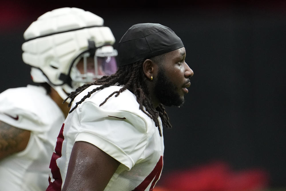 Luketa runs with teammates during training camp practice in July.