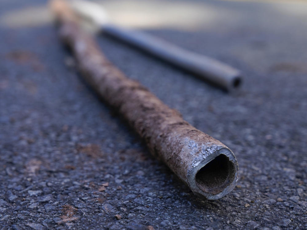 Lead water pipes pulled from underneath the street in Newark, N.J., in 2021.