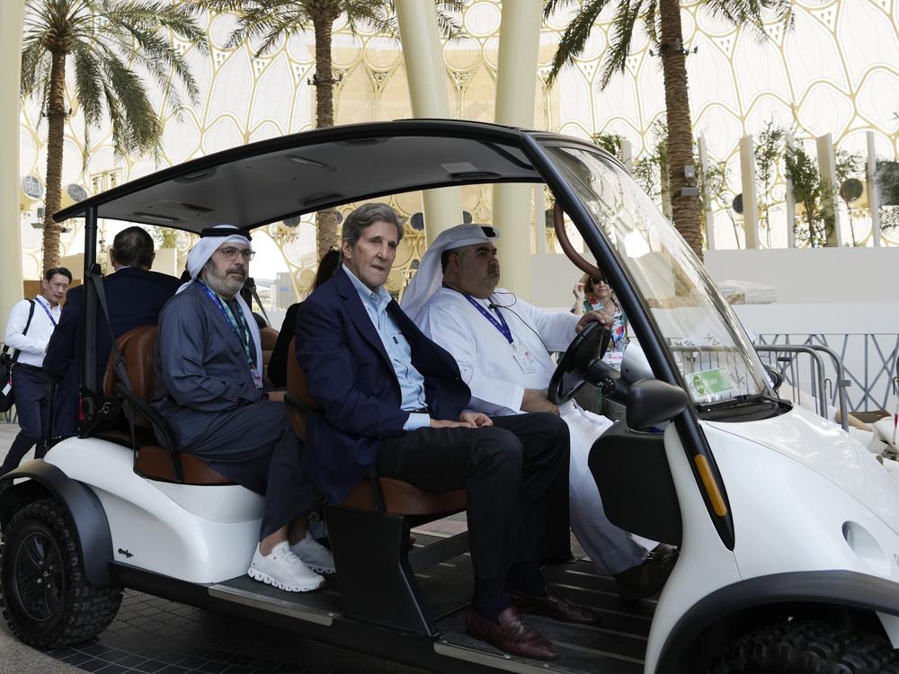 John Kerry, U.S. Special Presidential Envoy for Climate, rides in a cart ahead of the COP28 U.N. Climate Summit, Wednesday, Nov. 29, 2023, in Dubai, United Arab Emirates.