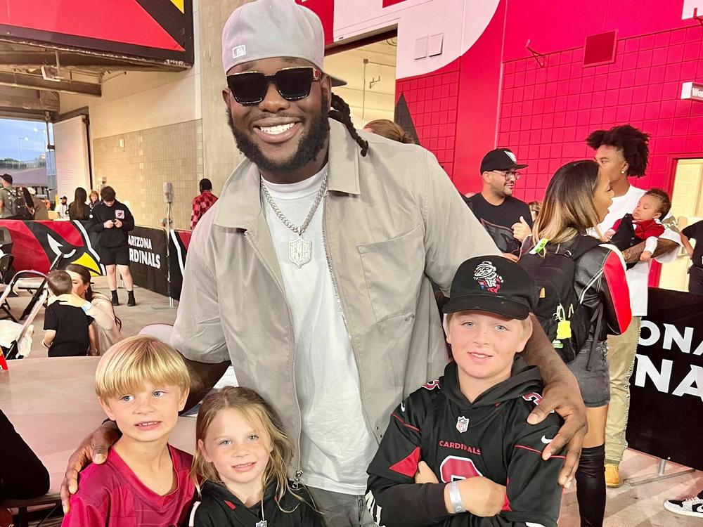 The Phillips family with their new favorite player, Jesse Luketa.