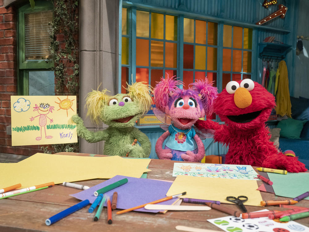 Karli (left) and Elmo (right) appear in Season 51 of Sesame Street. In separate videos and stories available for free online, Karli, Elmo and supportive adult characters discuss how Karli's mother is in recovery for an unspecified addiction.