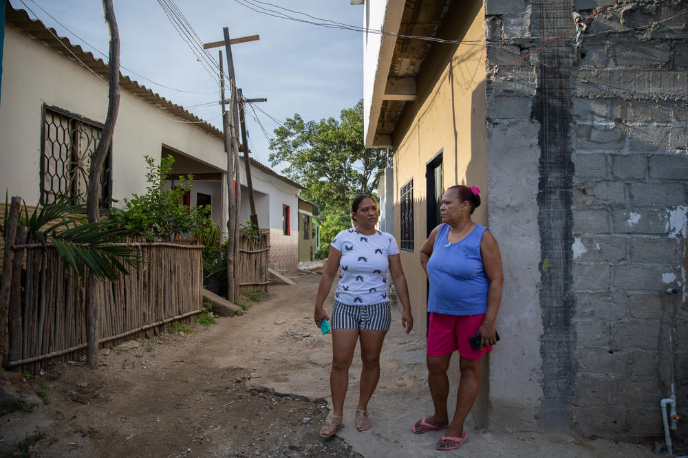 July (left) recalls gathering water from a nearby creek when she was a child, along with her mother, Ana (right). July says the access to water isn't much better since water delivery in their section of La Paz was cut from twice a month to once a month.