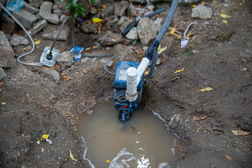 An electric motor pump is essential to push water from the utility's pipes to private homes in La Paz. A community leader says residents began using pumps for this purpose some 30 years ago.