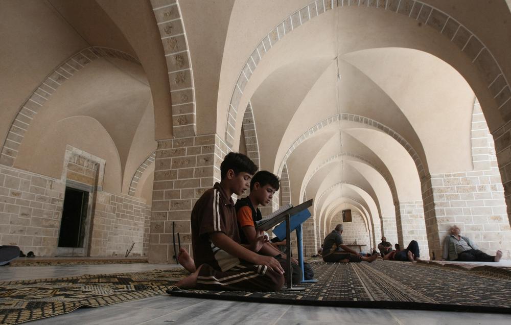 Palestinian boys read the Koran at the Great Omari Mosque in Gaza City on Aug. 1, 2011.