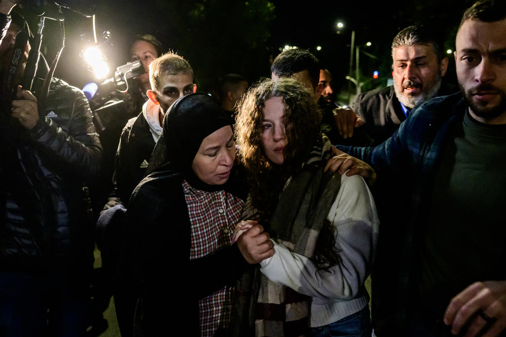 Newly released activist Ahed Tamimi (center) is greeted by relatives during a welcome ceremony following the release of Palestinian prisoners from Israeli jails in exchange for Israeli hostages held in Gaza by Hamas since the Oct. 7 attacks, in Ramallah in the occupied West Bank early on Thursday.