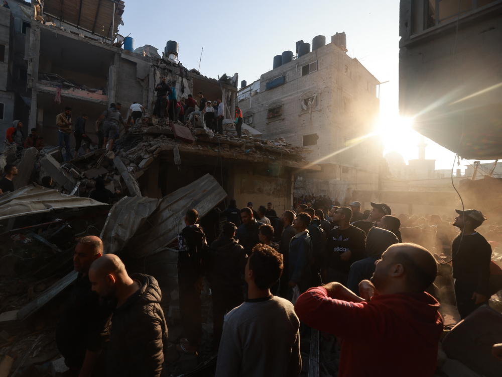 Palestinians inspect the destruction following an Israeli airstrike on the Rafah refugee camp in the southern Gaza Strip on Friday.