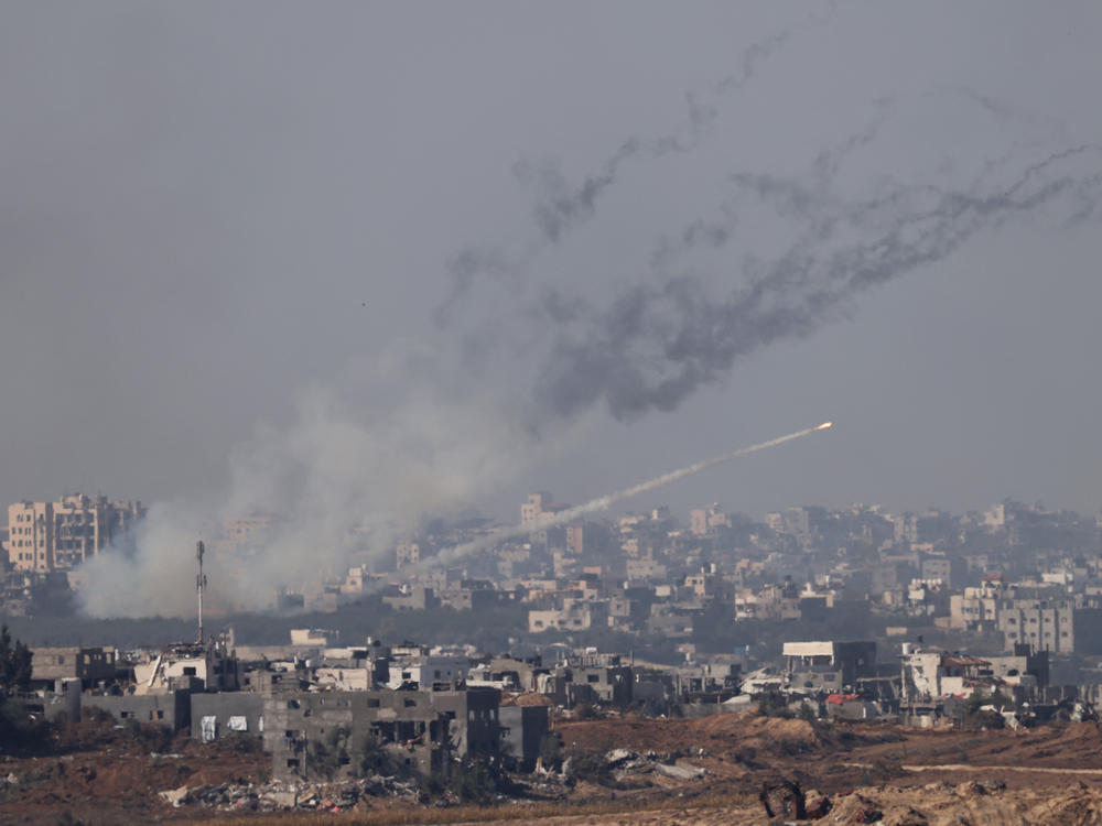 This picture taken from southern Israel near the border with the Gaza Strip shows a rocket being fired from inside the Gaza Strip towards Israel, as battles resumed between the Israeli forces and Hamas militants, on Friday.