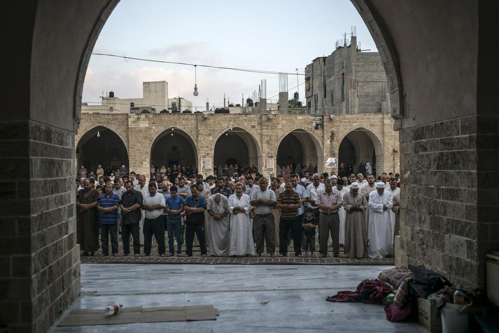 Worshippers in morning prayer at the Great Omari Mosque in Gaza City on July 28, 2014.
