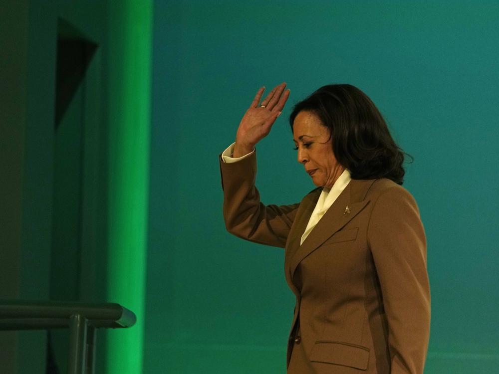 Vice President Harris waves as she leaves the stage after speaking to leaders during the COP28 U.N. Climate Summit on Dec. 2, 2023 in Dubai, United Arab Emirates.