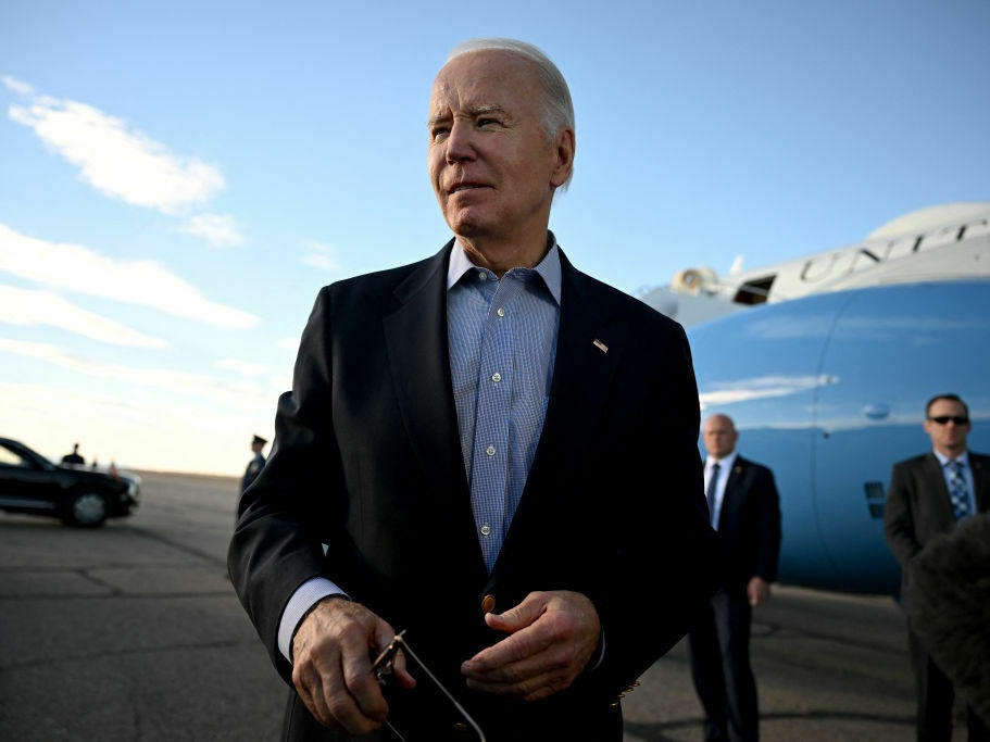 President Biden speaks to reporters before boarding Air Force One at Pueblo Memorial Airport in Pueblo, Colo., on Nov. 29.