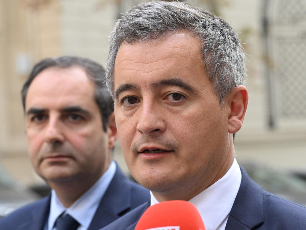 FILE - French Interior Minister Gerald Darmanin, right, talks to the media after a meeting on Oct. 9, 2023, in Paris. French police arrested a man who targeted passersby in Paris on Saturday night, Dec. 2, 2023, killing a German tourist with a knife and injuring two others, France's Interior Minister Darmanin said.