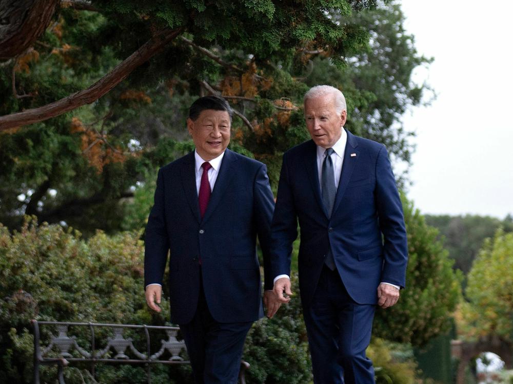 President Joe Biden and Chinese President Xi Jinping walk together after meeting in November.