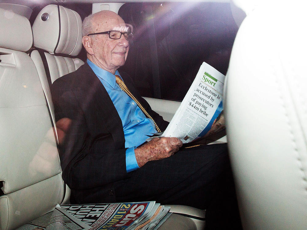 Rupert Murdoch, shown in London in July 2011, sought for years to acquire full control of Sky. His British newspaper arm now faces allegations its tabloids hacked into Cabinet ministers' voice mails to pressure them to allow the deal to go through.