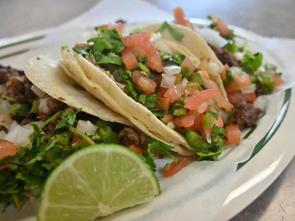 Chicken, carne asada, and beef tacos with a side of rice from the kitchen of Las Palmas Restaurante in Kansas City, Kansas.