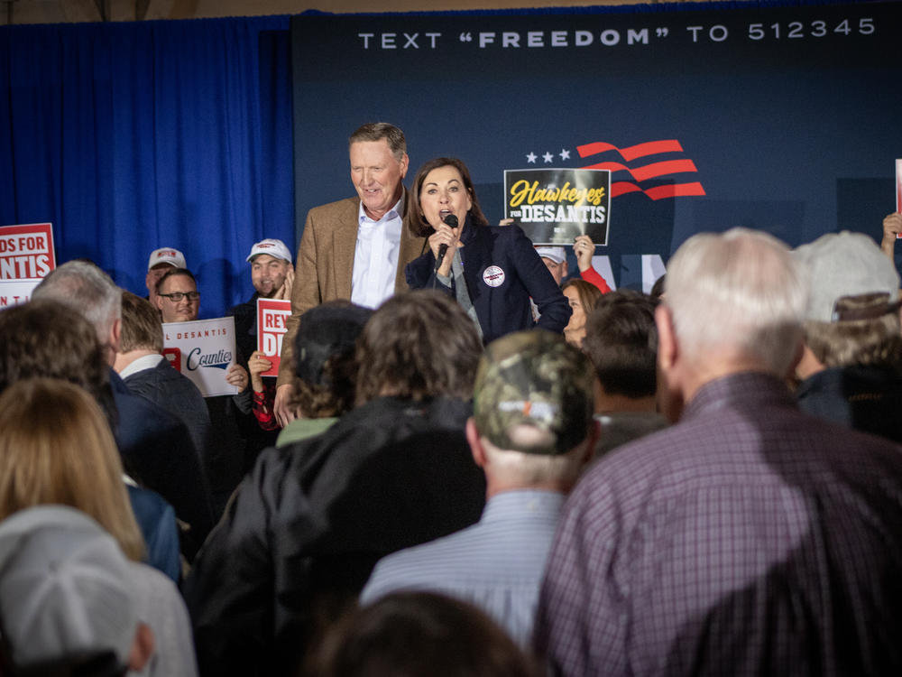 Iowa Gov. Kim Reynolds and influential Iowa evangelical Christian leader Bob Vander Plaats speak ahead of Florida Gov. Ron DeSantis's speech upon completing his 99 county tour of Iowa in Newton, Iowa.