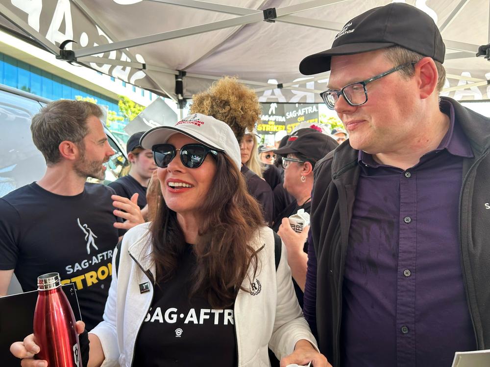 SAG-AFTRA president Fran Drescher and national executive director Duncan Crabtree-Ireland walk the picket line outside Netflix.