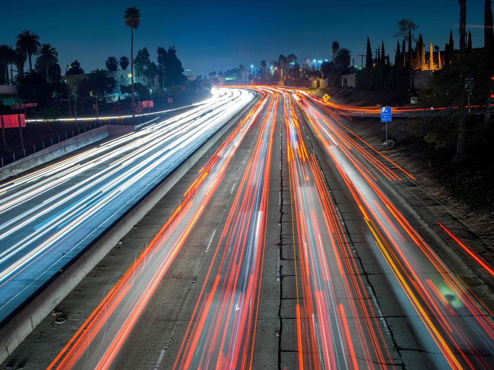 Cars and trucks move slowly during evening rush hour on the Hollywood Freeway in Los Angeles, Calif. in 2014.