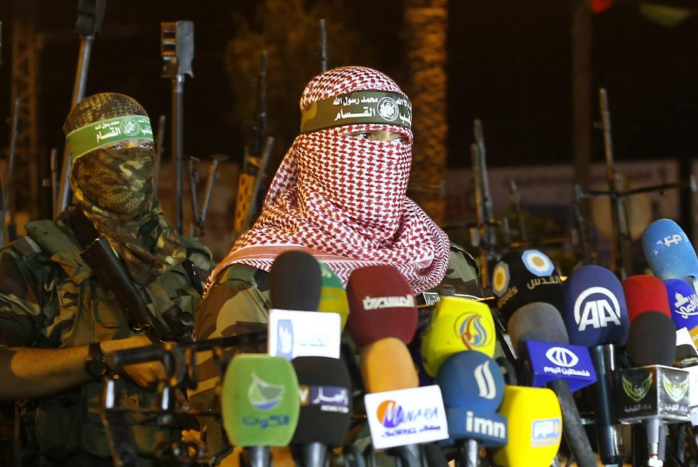 A person identifying as Abu Obeida delivers a statement in July 2015.