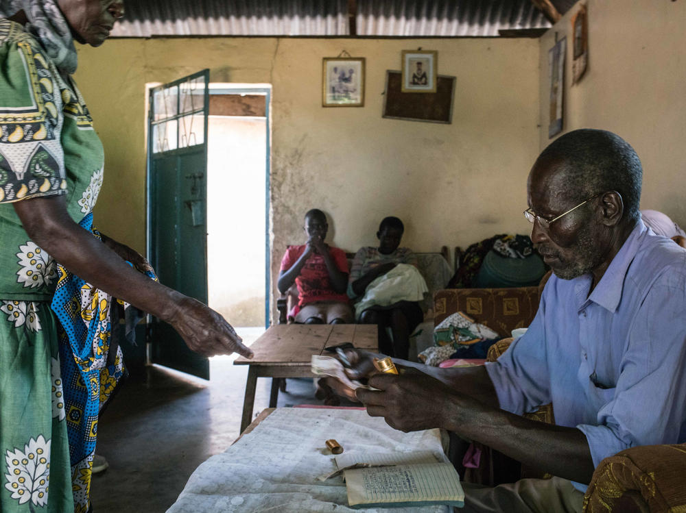 A 2017 meeting of a rotating savings club formed in a village near Lake Victoria soon after every adult there was chosen to receive a monthly through GiveDirectly's experiment. The clubs have enabled recipients to convert their grants into lump sum payments: Each month the members put $10 into the communual pot — for a total of $100 — and a different person takes it home.