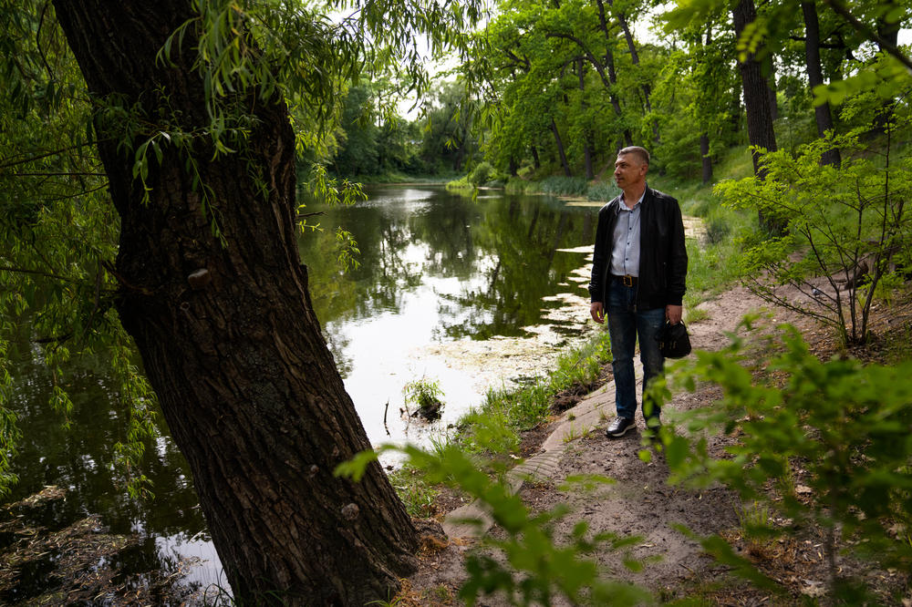 Roman German walks through a park in Kyiv, where he now lives. He was displaced from the occupied city of Enerhodar where he worked at the Zaporizhzhia Nuclear Power Plant.