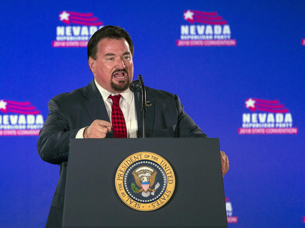 Nevada Republican Party Chair Michael McDonald announces then-President Donald Trump before he speaks at the party's convention on June 23, 2018, in Las Vegas.