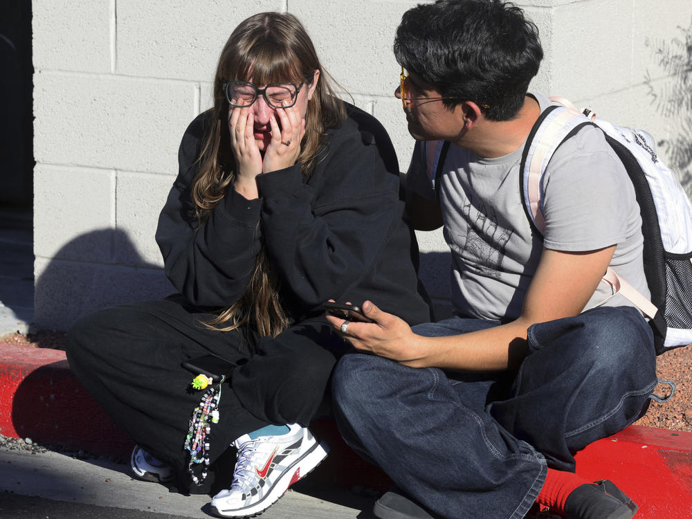 Amanda Perez, left, is comforted by fellow student Alejandro Barron following a shooting on the University of Nevada, Las Vegas, campus, Wednesday, Dec. 6, 2023, in Las Vegas.