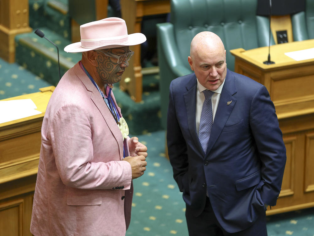 Māori Party co-leader Rawiri Waititi speaks to Prime Minister Christopher Luxon during the State Opening of Parliament on December 6 in Wellington, New Zealand. Luxon has called for the abolishment of tough anti-smoking measures — and the Māori Health Authority.