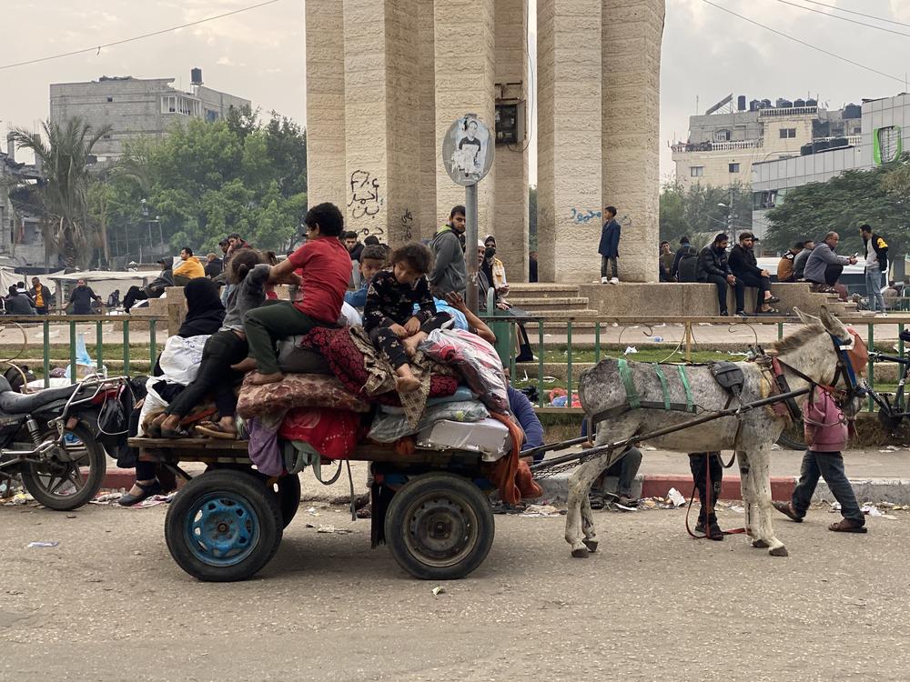 A family fleeing Israel's bombardment in Gaza, in a photo taken on Tuesday, near Rafah, Gaza.