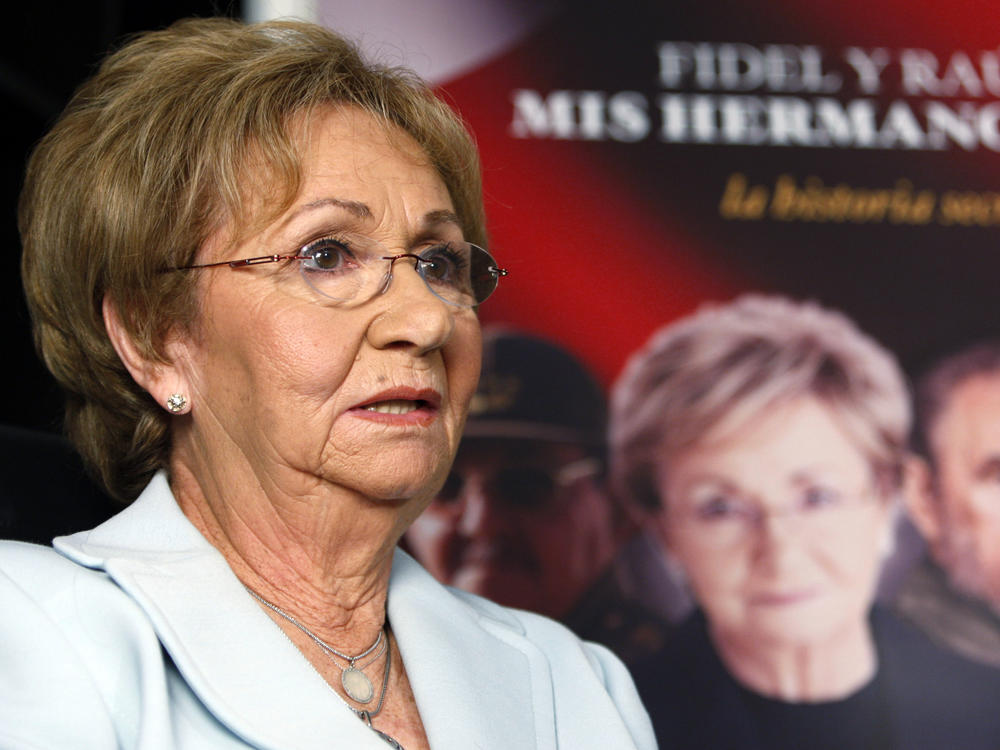 Juanita Castro, sister of Fidel Castro, talks to a reporter, Oct. 27, 2009, in Miami. Juanita Castro, the anti-communist sister of Cuban rulers Fidel and Raul Castro who worked with the CIA against their government, has died in Miami at age 90.