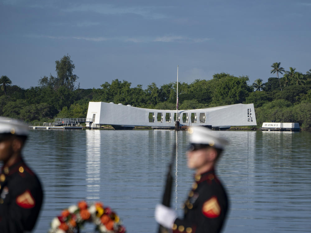 U.S. Marines prepare to fire a salute in front of the USS Arizona Memorial during the 82nd Pearl Harbor Remembrance Day ceremony on Thursday, Dec. 7, 2023, at Pearl Harbor in Honolulu, Hawaii.