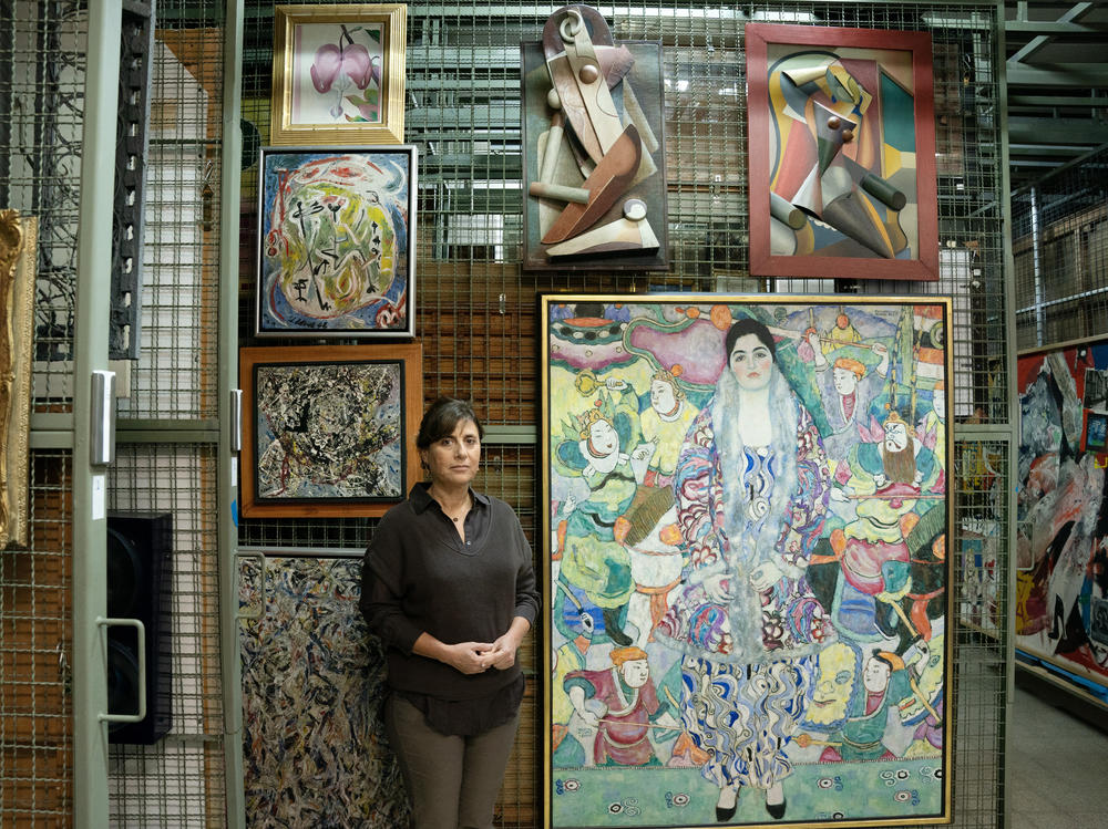 Artwork from the Tel Aviv Museum of Art, which were moved into the museum's underground safe to protect them from possible damage caused by rocket attacks, amid the ongoing conflict between Israel and Hamas, on Nov. 14. Tel Aviv museum director Tania Coen-Uzzielli poses in front of Gustav Klimt's 
