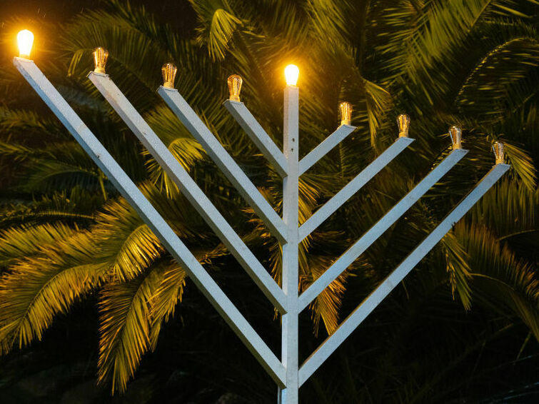 A Menorah stands partly lit outside Hackney Town Hall to mark the arrival of Hanukkah on December 7, 2023 in London, England.