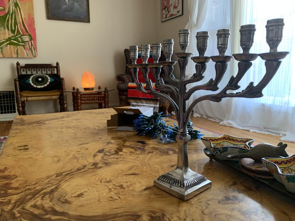 Jews around the U.S. are balancing the desire to celebrate Hanukkah and the need to feel safe.